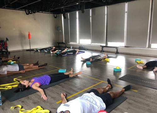 Diala leading savasana with straps and blocks